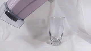 pouring the strawberry vanilla banana protein shake